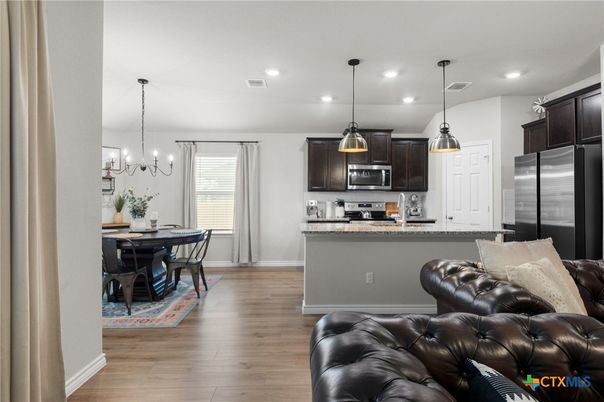 Chandelier, Dining room, Interior, Kitchen, Pendant Lights, Recessed Lighting, Stainless Steel Appliances, Wood Texture Flooring