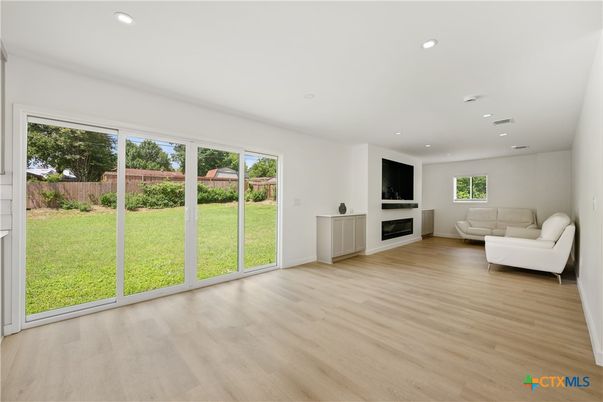 Empty room, Fireplace, Interior, Recessed Lighting, Wood Texture Flooring