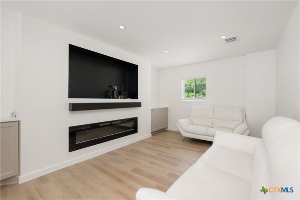 Fireplace, Interior, Living room, Recessed Lighting, Wood Texture Flooring