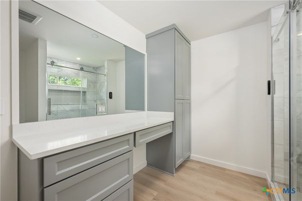 Bathroom, Glass Shower, Interior, Marble Walls, Recessed Lighting, Wood Texture Flooring