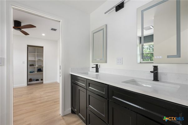 Bathroom, Dual Sink Vanities, Interior, Recessed Lighting, Wood Texture Flooring