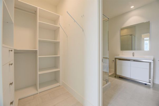 Bathroom, Dual Sink Vanities, Interior, Recessed Lighting, Walk-in Closets