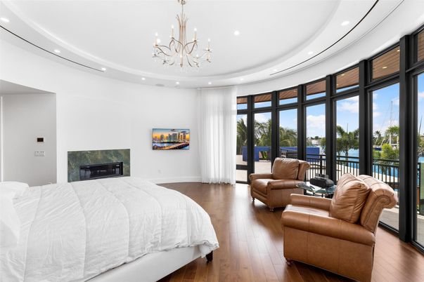Bedroom, Chandelier, Fireplace, Interior, Recessed Lighting, Water, Wood Texture Flooring