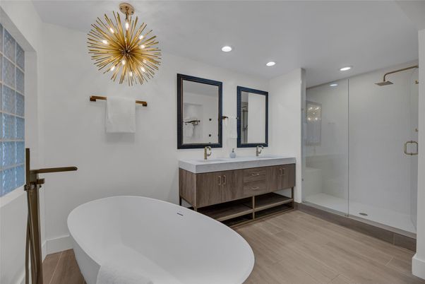 Bathroom, Dual Sink Vanities, Free Standing Baths, Glass Shower, Interior, Pendant Lights, Recessed Lighting, Wood Texture Flooring