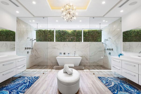 Bathroom, Chandelier, Free Standing Baths, Glass Shower, Interior, Marble Walls, Recessed Lighting, Wood Texture Flooring