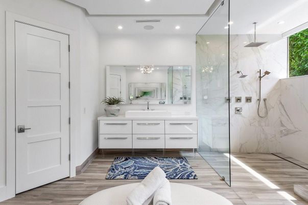 Bathroom, Dual Sink Vanities, Glass Shower, Interior, Marble Walls, Recessed Lighting, Wood Texture Flooring