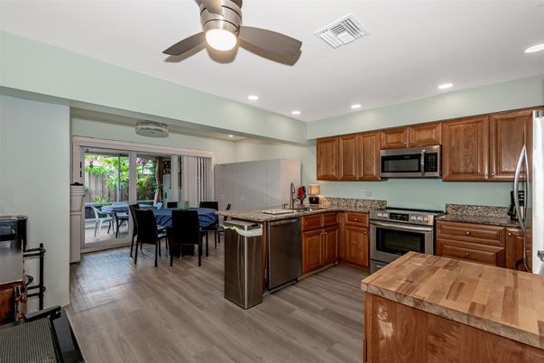 Dining room, Interior, Kitchen, Recessed Lighting, Stainless Steel Appliances, Wood Texture Flooring