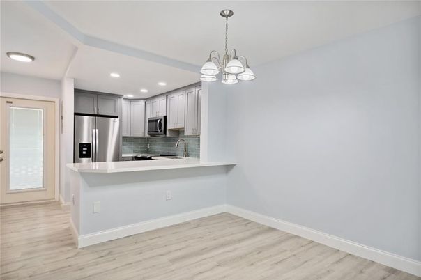 Chandelier, Interior, Kitchen, Recessed Lighting, Stainless Steel Appliances, Wood Texture Flooring