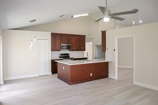Interior, Kitchen, Pendant Lights, Recessed Lighting, Stainless Steel Appliances, Wood Texture Flooring