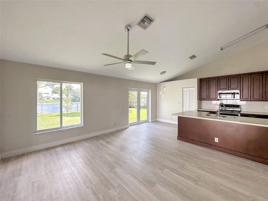 Empty room, Interior, Kitchen, Stainless Steel Appliances, Wood Texture Flooring