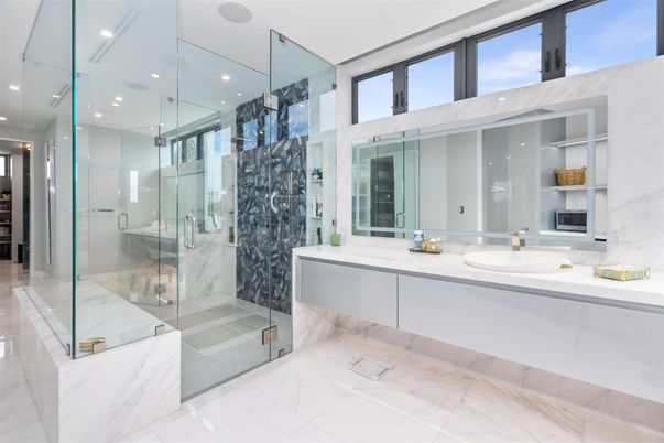 Bathroom, Dual Sink Vanities, Glass Shower, Interior, Marble, Marble Walls, Recessed Lighting