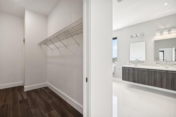 Bathroom, Dual Sink Vanities, Interior, Recessed Lighting, Walk-in Closets, Wood Texture Flooring