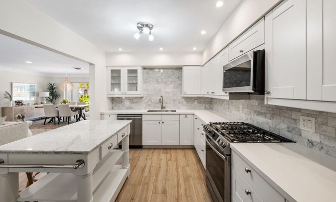Dining room, Interior, Kitchen, Pendant Lights, Recessed Lighting, Stainless Steel Appliances, Wood Texture Flooring