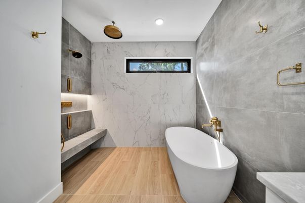 Bathroom, Free Standing Baths, Interior, Marble Walls, Recessed Lighting, Wood Texture Flooring