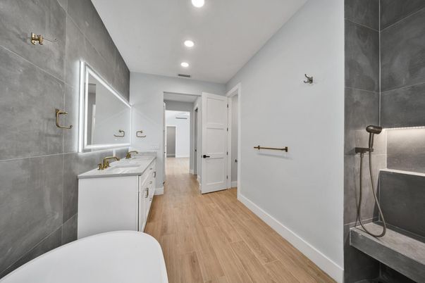 Bathroom, Dual Sink Vanities, Free Standing Baths, Interior, Recessed Lighting, Wood Texture Flooring