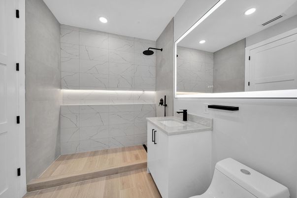 Bathroom, Glass Shower, Interior, Marble Walls, Recessed Lighting, Wood Texture Flooring