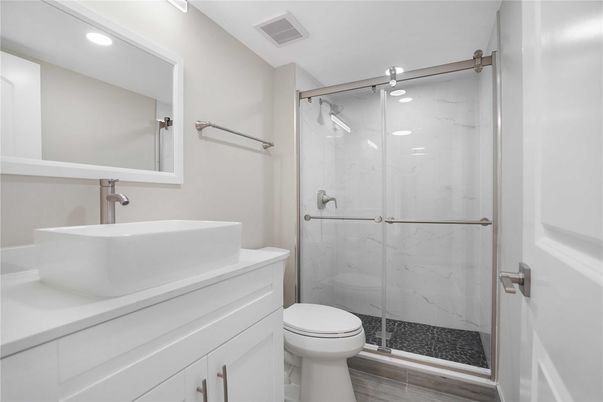 Bathroom, Glass Shower, Interior, Marble Walls, Recessed Lighting, Wood Texture Flooring