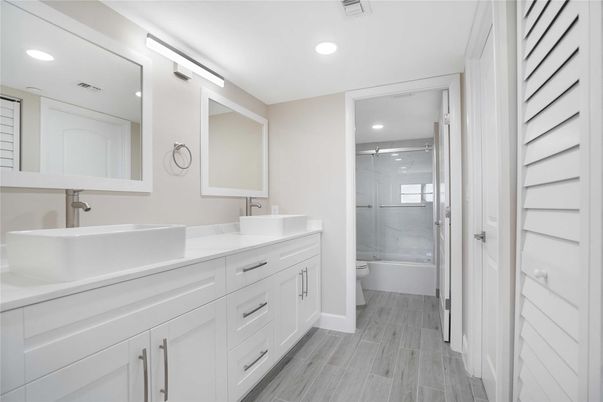 Bathroom, Dual Sink Vanities, Glass Shower, Interior, Recessed Lighting, Wood Texture Flooring