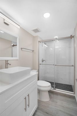 Bathroom, Glass Shower, Interior, Marble Walls, Recessed Lighting, Wood Texture Flooring