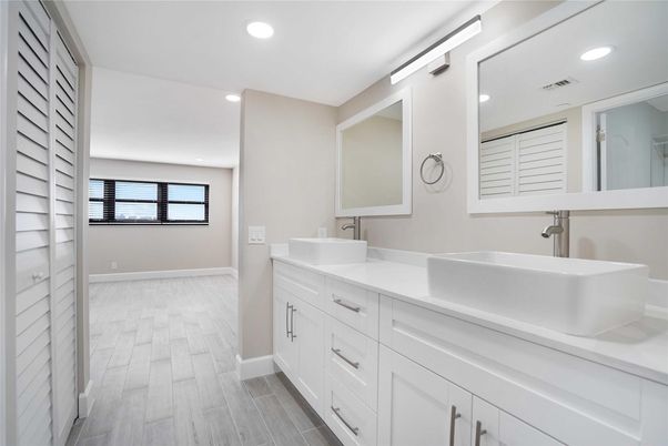 Bathroom, Dual Sink Vanities, Interior, Recessed Lighting, Wood Texture Flooring