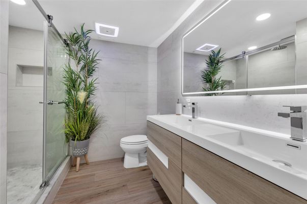 Bathroom, Dual Sink Vanities, Glass Shower, Interior, Recessed Lighting, Wood Texture Flooring