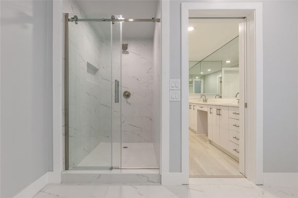 Bathroom, Glass Shower, Interior, Marble, Marble Walls, Recessed Lighting, Wood Texture Flooring