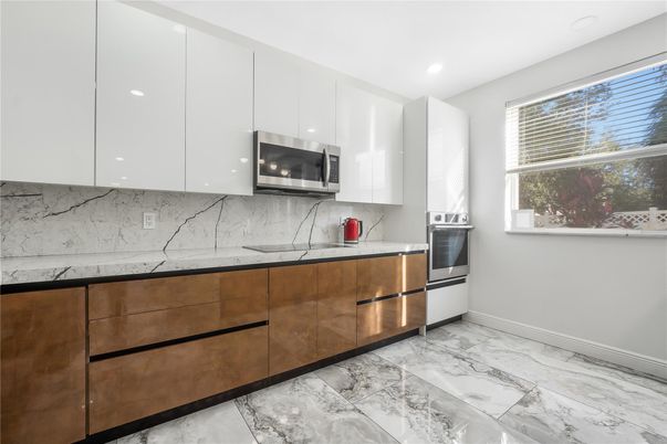 Interior, Kitchen, Marble, Marble Walls, Recessed Lighting, Stainless Steel Appliances