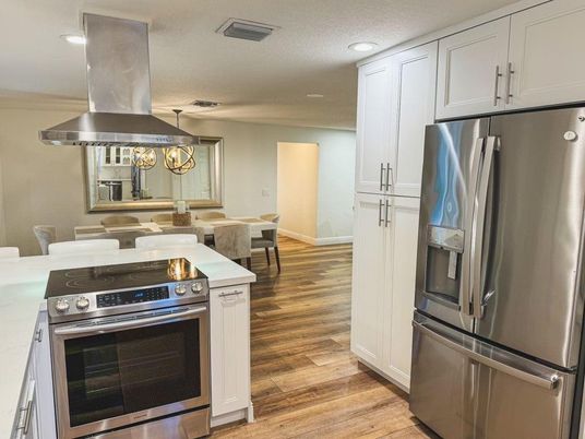 Dining room, Interior, Kitchen, Recessed Lighting, Stainless Steel Appliances, Wood Texture Flooring