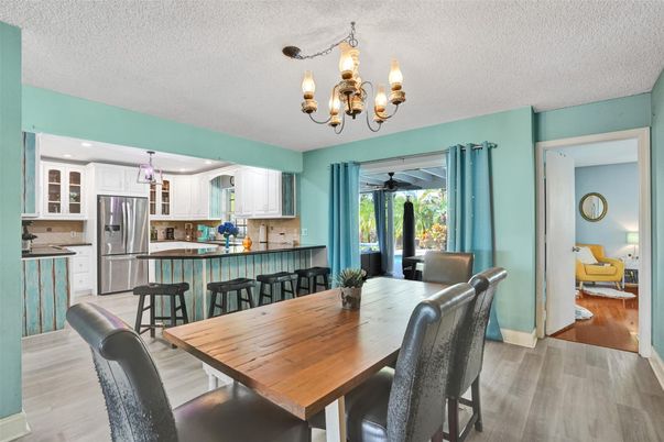 Chandelier, Dining room, Interior, Kitchen, Stainless Steel Appliances, Wood Texture Flooring