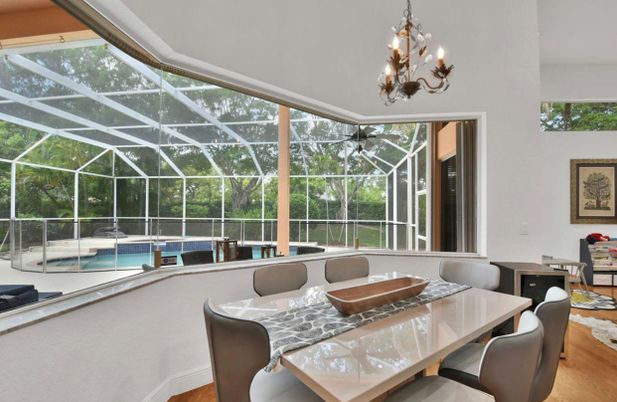 Chandelier, Dining room, Glass Ceilings, Interior, Pool, Sun Room, Wood Texture Flooring