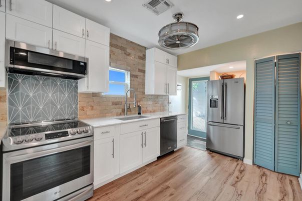 Interior, Kitchen, Recessed Lighting, Stainless Steel Appliances, Stone Walls, Wood Texture Flooring