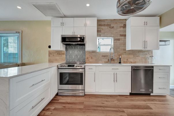 Interior, Kitchen, Recessed Lighting, Stainless Steel Appliances, Stone Walls, Wood Texture Flooring