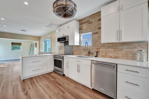 Interior, Kitchen, Recessed Lighting, Stainless Steel Appliances, Stone Walls, Wood Texture Flooring