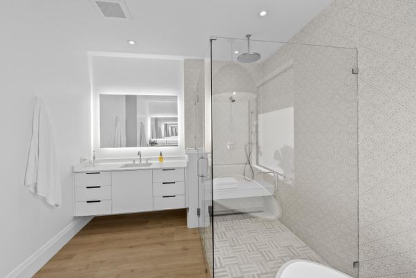 Bathroom, Dual Sink Vanities, Glass Shower, Interior, Recessed Lighting, Wood Texture Flooring