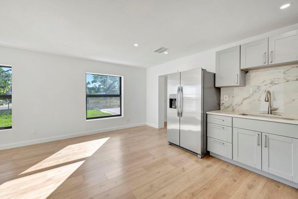 Interior, Kitchen, Marble Walls, Recessed Lighting, Stainless Steel Appliances, Wood Texture Flooring