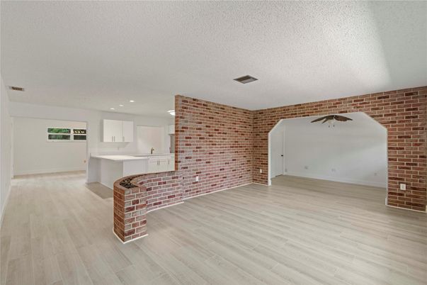 Empty room, Interior, Kitchen, Recessed Lighting, Stone Walls, Wood Texture Flooring