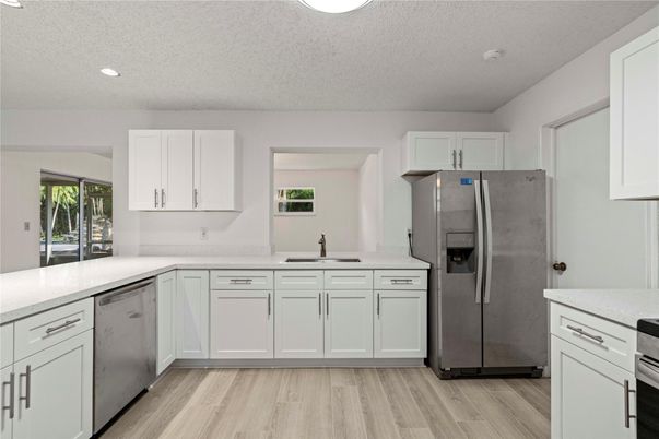 Interior, Kitchen, Recessed Lighting, Stainless Steel Appliances, Wood Texture Flooring