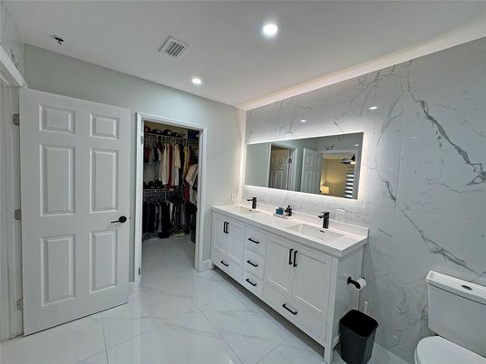 Bathroom, Dual Sink Vanities, Interior, Marble, Marble Walls, Recessed Lighting