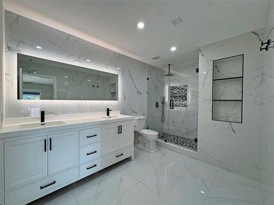 Bathroom, Dual Sink Vanities, Interior, Marble, Marble Walls, Recessed Lighting