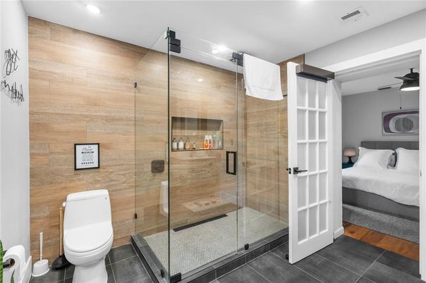 Bathroom, Bedroom, Glass Shower, Interior, Recessed Lighting, Wood Texture Flooring
