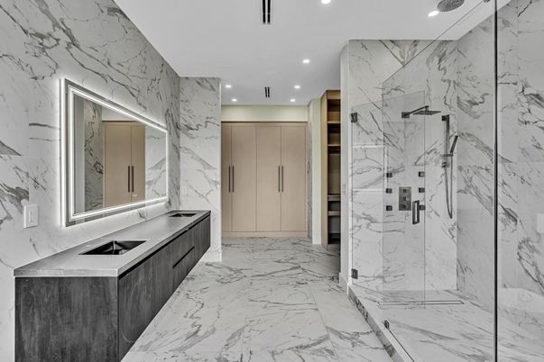 Bathroom, Dual Sink Vanities, Glass Shower, Interior, Marble, Marble Walls, Recessed Lighting