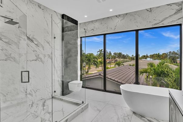 Bathroom, Free Standing Baths, Glass Shower, Interior, Marble, Marble Walls, Recessed Lighting