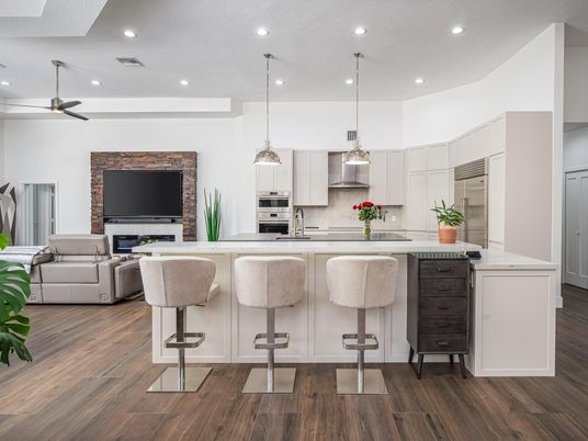 Fireplace, Interior, Kitchen, Living room, Pendant Lights, Recessed Lighting, Stainless Steel Appliances, Stone Walls, Wood Texture Flooring