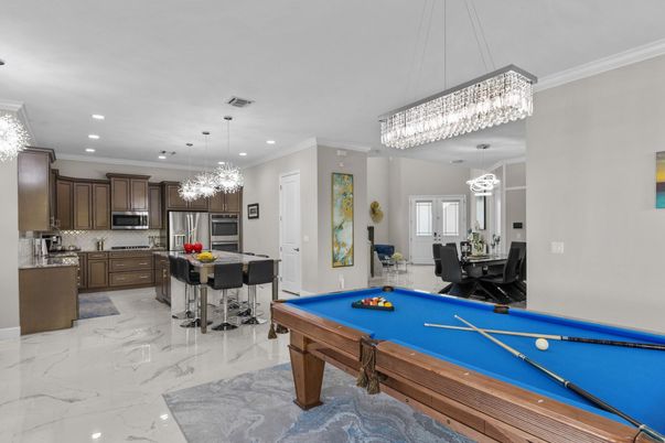 Billiard Table, Chandelier, Dining room, Interior, Kitchen, Marble, Pendant Lights, Recessed Lighting, Stainless Steel Appliances