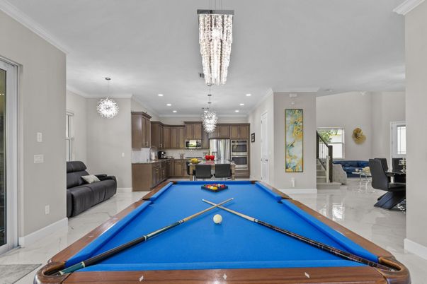 Billiard Table, Chandelier, Game Room, Interior, Kitchen, Marble, Pendant Lights, Recessed Lighting, Stainless Steel Appliances