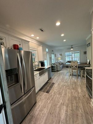 Dining room, Interior, Kitchen, Recessed Lighting, Stainless Steel Appliances, Wood Texture Flooring