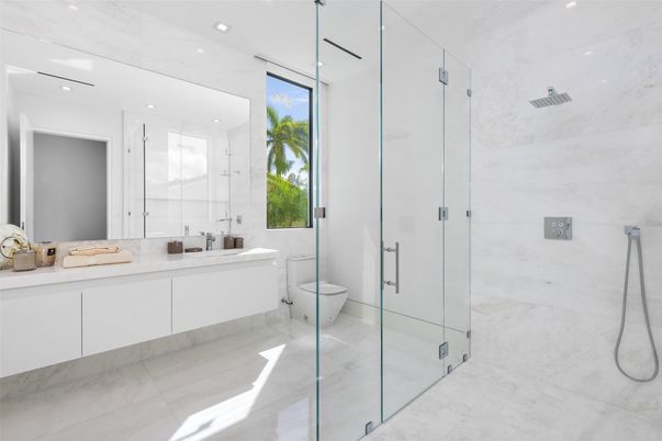 Bathroom, Dual Sink Vanities, Glass Shower, Interior, Marble, Marble Walls, Recessed Lighting