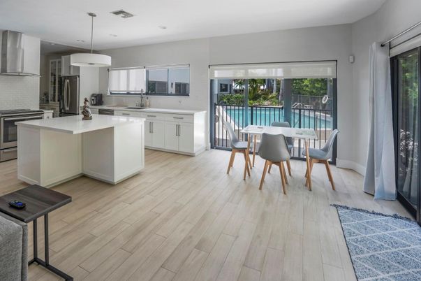 Dining room, Interior, Kitchen, Pendant Lights, Recessed Lighting, Stainless Steel Appliances, Wood Texture Flooring