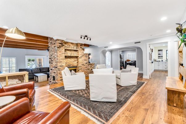 Fireplace, Interior, Living room, Recessed Lighting, Stone Walls, Wood Texture Flooring