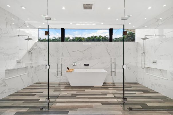 Bathroom, Free Standing Baths, Glass Shower, Interior, Marble Walls, Recessed Lighting, Wood Texture Flooring